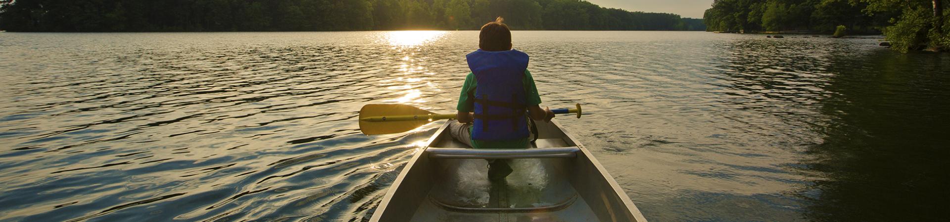 Man in a canoe.